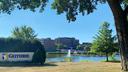 A health system campus framed by trees with a sign that says “Guthrie.”