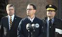 Gov. Josh Shapiro (center) is flanked by Dauphin County DA Fran Chardo (left) and Colonel Christopher Paris of the State Police.