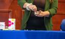 A person demonstrates how to use drug test strips.