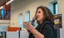 Maria-Manautou-Matos speaks into a microphone.