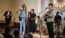 Conrad Fisher, Rose Stoltzfus and Ben Stoltzfus perform at Ragamuffin Hall in McCoysville, Pa., Saturday, April 25, 2026.