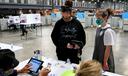 Volunteer poll workers assist with the setup, opening, and closing of a polling place.