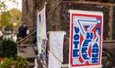 Voting signs in Philadelphia in 2021. In odd-year elections like these, many local candidates cross-file.