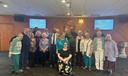 Mandy Mastros (center) surrounded by a group of Lancaster Moravian Church congregants.