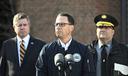 Gov. Josh Shapiro (center) is flanked by Dauphin County DA Fran Chardo (left) and Colonel Christopher Paris of the State Police