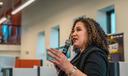 Maria-Manautou-Matos speaks into a microphone.