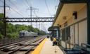 A man sits on a SEPTA platform.