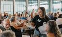 Spotlight PA Rural Affairs Reporter Marley Parish collects quiz sheets at the 2024 Clink and Think Quiz Bash Fundraiser at Axemann Brewery in Bellefonte.