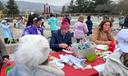 Bethlehem Mayor J. William Reynolds signs bookmarks at a tree decorating event on Nov. 21, 2025.