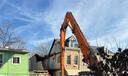 An emergency crew works to dismantle a Poplar Street home in Reading, following a partial building collapse.