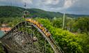 Riders on Knoebels’ Phoenix roller coaster begin their descent.