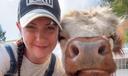 April Crossley with pet Highland cow