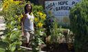 Philadelphia Gardener Estelle Vaughn stands among plants