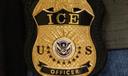 A federal agent wears an Immigration and Customs Enforcement badge in New York, June 10, 2025.