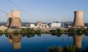 At Constellation's nuclear power plant on Three Mile Island, called the Crane Clean Energy Center, near Middletown, Pa., the cooling towers are reflected in the Susquehanna River at sunrise, June 25, 2025.
