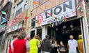 Fans arrive to watch a Champion league soccer match between Arsenal and Paris Saint-Germain at the Lion Sports Bar, in Philadelphia.