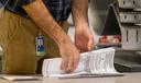 A worker preparing 2022 ballots in Philadelphia. A new bill would give counties more time to prep these ballots.