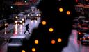 Pedestrians cross South Broad Street in Philadelphia during a rainy winter storm in October of 2022.