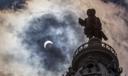 The statue of William Penn atop Philadelphia's City Hall is silhouetted by the partial solar eclipse in 2017.