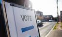 A “vote” sign outside of a polling place.