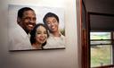A family photo hangs on a wall in the dining room of Fe and Gareth Hall's home in Stroudsburg.