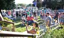 People gather on the front lawn outside of the Tioga borough building.