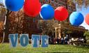 Students on the campus of the University of Pittsburgh walk past a ‘vote’ sign on Election Day, Nov. 5., 2024.