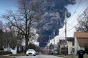A black plume rises over East Palestine, Ohio, as a result of a controlled detonation of a portion of the derailed Norfolk Southern trains Monday, Feb. 6, 2023.