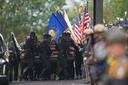 Pallbearers carry the coffin of a slain officer during funeral services for Northern York County Regional Police detectives in Red Lion, PA