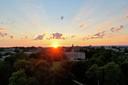 The sun shines over Old Main on Penn State’s University Park campus.