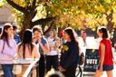 College students from the University of Pittsburgh and Carnegie Mellon University enter the polling station at Bellefield Hall on Nov. 5, 2024.