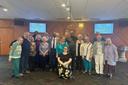 Mandy Mastros (center) surrounded by a group of Lancaster Moravian Church congregants.