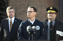 Gov. Josh Shapiro (center) is flanked by Dauphin County DA Fran Chardo (left) and Colonel Christopher Paris of the State Police