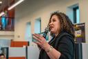 Maria-Manautou-Matos speaks into a microphone.