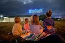 Children watch the inaugural Goose Day drone light show in downtown Lewistown in 2023.