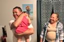 Erasmo Zavala hugs his granddaughter, Selene, as his wife Maria stands nearby. A picture of Selene’s mother, Selena, who was murdered, hangs behind the family. May 29, 2026.