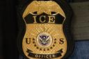 A federal agent wears an Immigration and Customs Enforcement badge in New York, June 10, 2025.