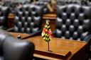 A miniature Maryland flag stands on a desk in the Maryland House of Delegates in Annapolis, Md., Wednesday, Jan. 14, 2015, the first day of the 2015 legislative session.
