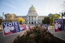 Signs outside Pennsylvania's capitol reminding people to vote before polls close Tuesday.