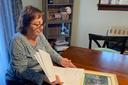Cyndi Compton looks through papers in her Tioga County home.