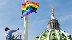 The LGBT flag flies at the Capitol building in Harrisburg.
