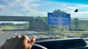 A "Welcome to Pennsylvania" sign.