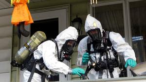 Members of the Pennsylvania State Police Clandestine Lab Response Team remove chemicals from the front porch of a home in Minersville in 2013. Members of the Pennsylvania State Police Clandestine Lab Response Team remove chemicals from the front porch of a home in Minersville in 2013.
