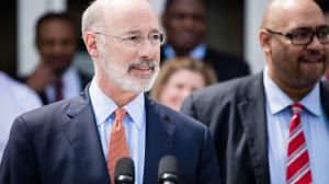 Gov. Tom Wolf (left) signed an order that directed the Department of Corrections, led by Secretary John Wetzel (right), to create a reprieve program for medically vulnerable inmates convicted of nonviolent crimes.