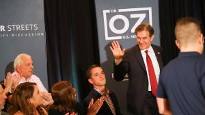Mehmet Oz waves as he enters his "safer streets" community roundtable discussion at Galdos Catering and Entertainment in South Philadelphia on Thursday, Oct. 13, 2022.