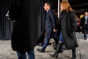 Governor Josh Shapiro, who has hired allies to advise him, leaves the Capitol with his wife Lori before being sworn in.