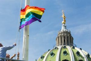 The LGBT flag flies at the Capitol building in Harrisburg.