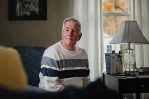 Election worker John "Jay" Schneider, 76, sits for a portrait at his Downingtown Pa. home on Monday, October 30, 2023.