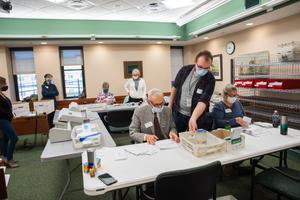 Volunteers opened and sorted mail-in ballots while poll watchers observed in Erie County on Nov. 3. The Erie County Board of Elections unanimously voted to certify its election results Thursday without any fanfare.