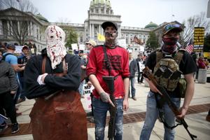 Protesters and militia gathered outside the Capitol in Harrisburg this April for a reopen protest. A recent report by a worldwide nonprofit that tracks militia groups said Pennsylvania is one of five U.S. states at high risk of violence through Nov. 3.